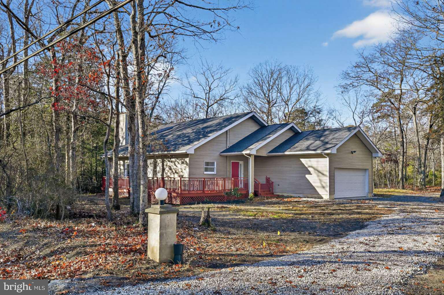 a view of a house with a yard covered with snow in front of house