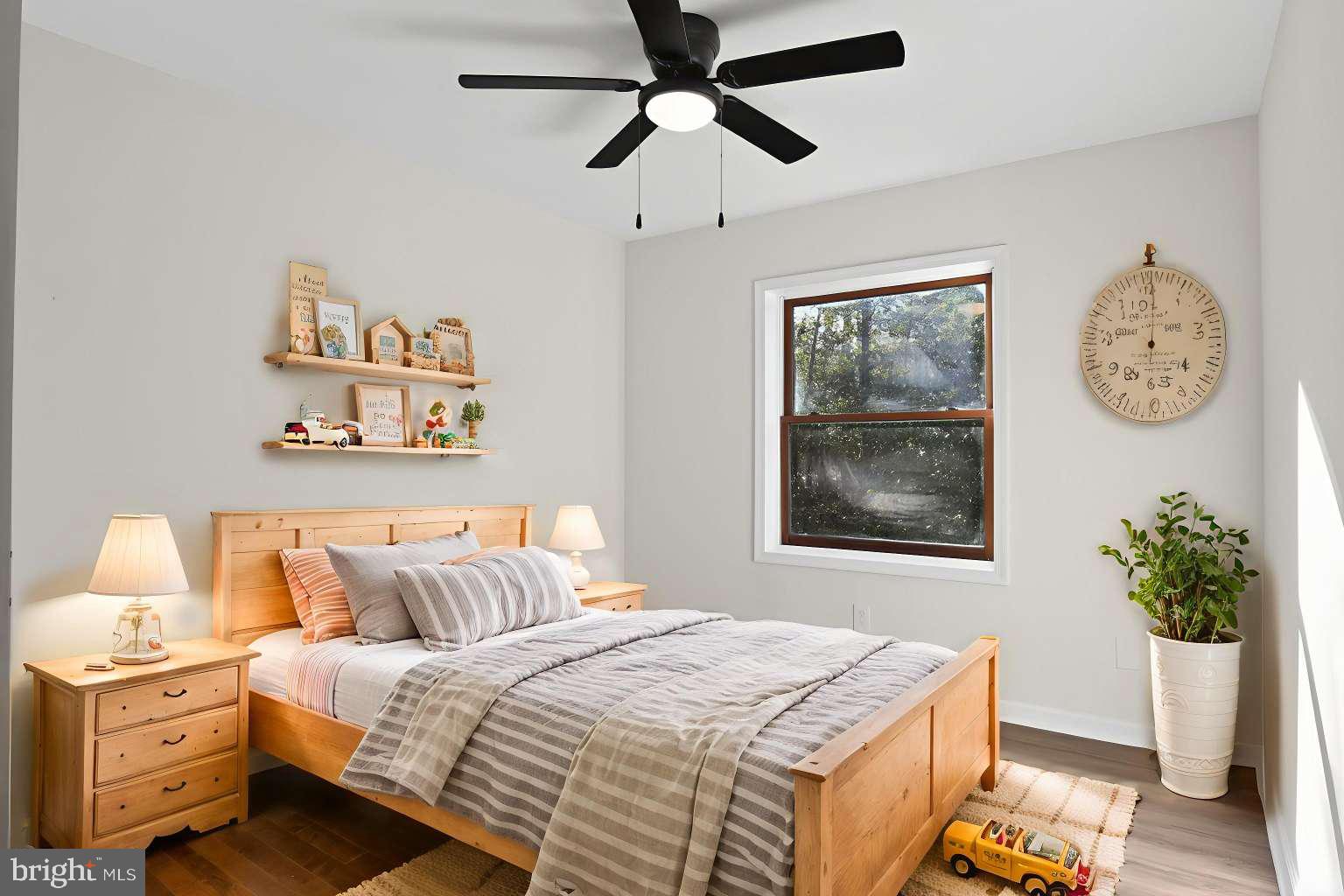 271 Academy Road Woodbine, NJ 08270 - Photo 11 of 37 a bedroom with a bed and a chandelier