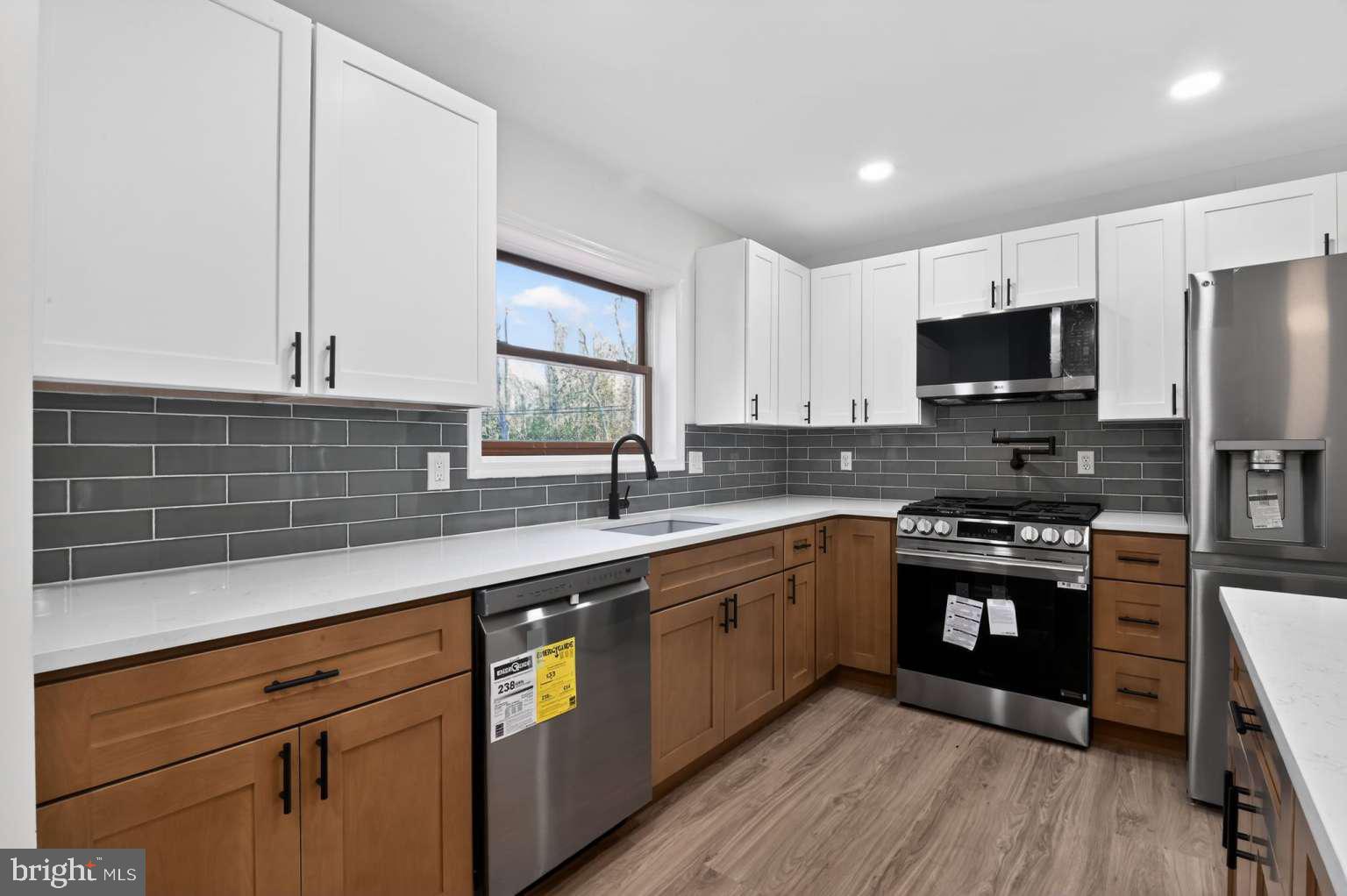 271 Academy Road Woodbine, NJ 08270 - Photo 23 of 37 a kitchen with stainless steel appliances granite countertop a sink a stove and cabinets