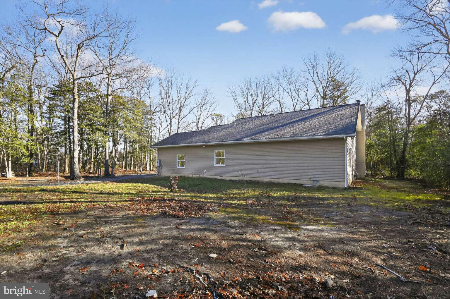 271 Academy Road Woodbine, NJ 08270 - Photo 8 of 37 a big house with a big yard and large trees