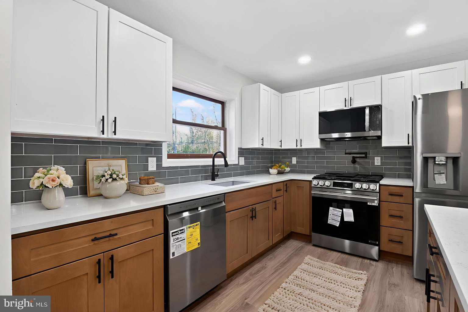 271 Academy Road Woodbine, NJ 08270 - Photo 10 of 37 a kitchen with stainless steel appliances granite countertop a stove a sink and a microwave