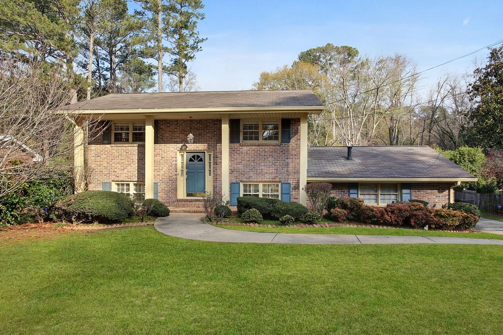 2562 Laurel Ridge Drive Decatur, GA 30033 - Photo 1 of 1 a front view of a house with a garden and plants