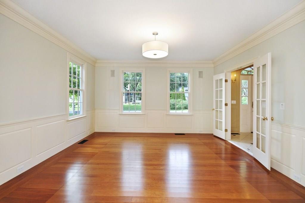 103 Revolutionary Road Concord, MA 01742 - Photo 11 of 39 an empty room with wooden floor and windows