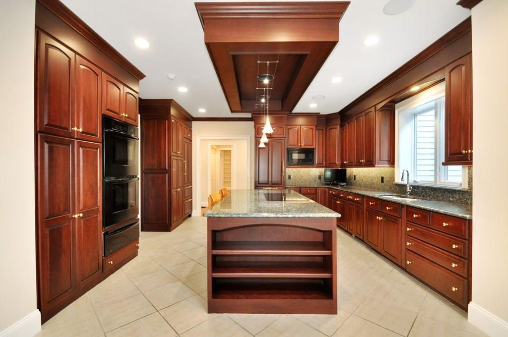 103 Revolutionary Road Concord, MA 01742 - Photo 14 of 39 a large kitchen with stainless steel appliances granite countertop a refrigerator and a sink