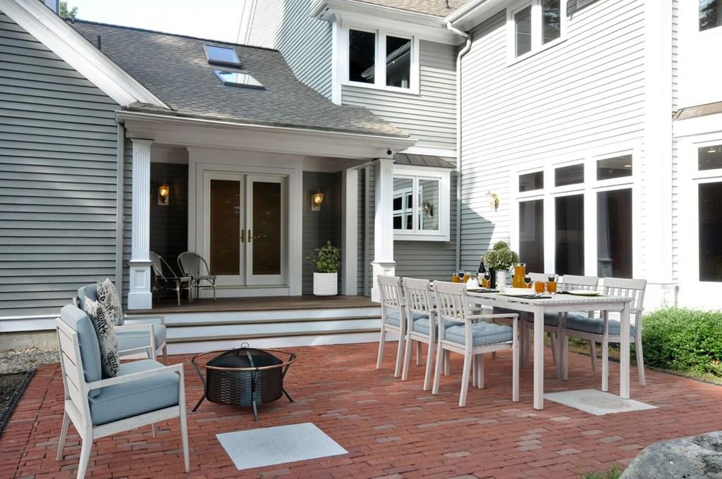 103 Revolutionary Road Concord, MA 01742 - Photo 18 of 39 a view of a patio with table and chairs