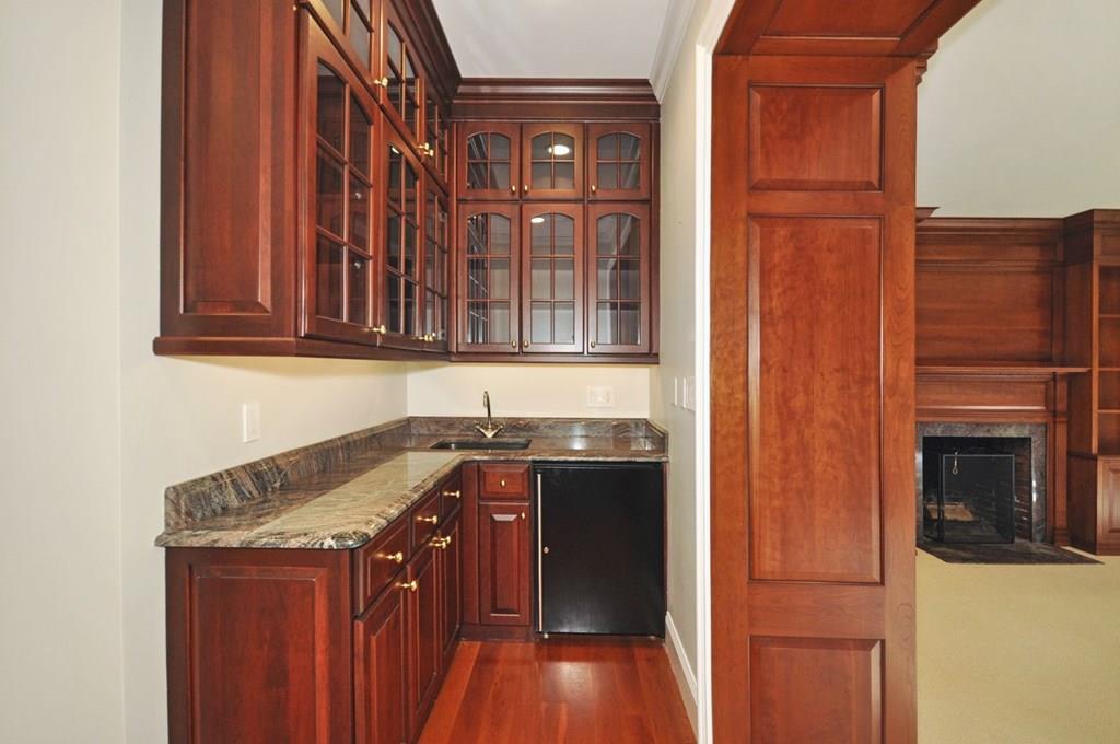 103 Revolutionary Road Concord, MA 01742 - Photo 26 of 39 a kitchen with a sink stove and cabinets