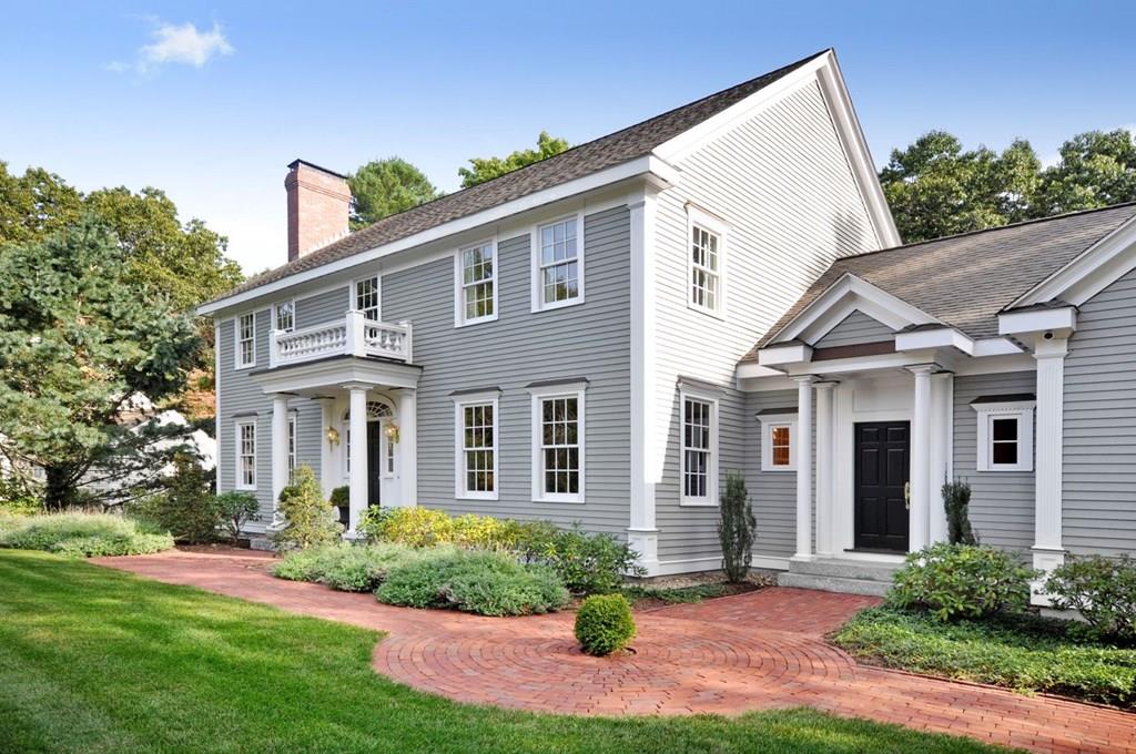 103 Revolutionary Road Concord, MA 01742 - Photo 3 of 39 a front view of a house with a yard and potted plants