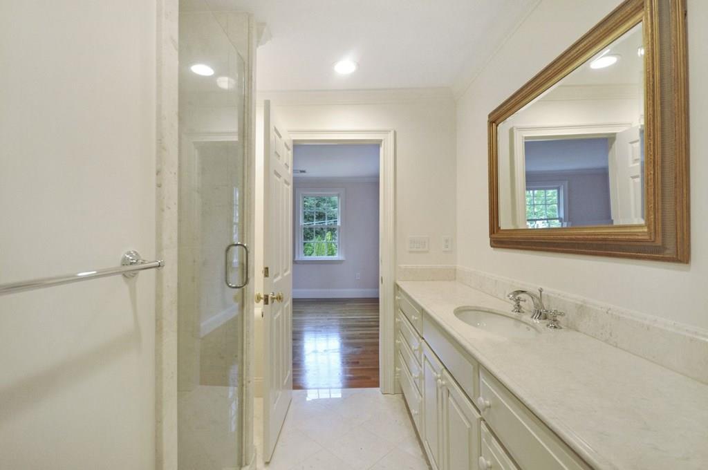 103 Revolutionary Road Concord, MA 01742 - Photo 35 of 39 a bathroom with a granite countertop sink mirror and double