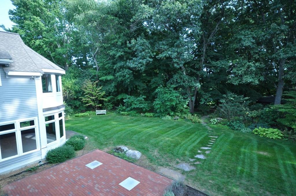 103 Revolutionary Road Concord, MA 01742 - Photo 39 of 39 a view of a backyard with a garden