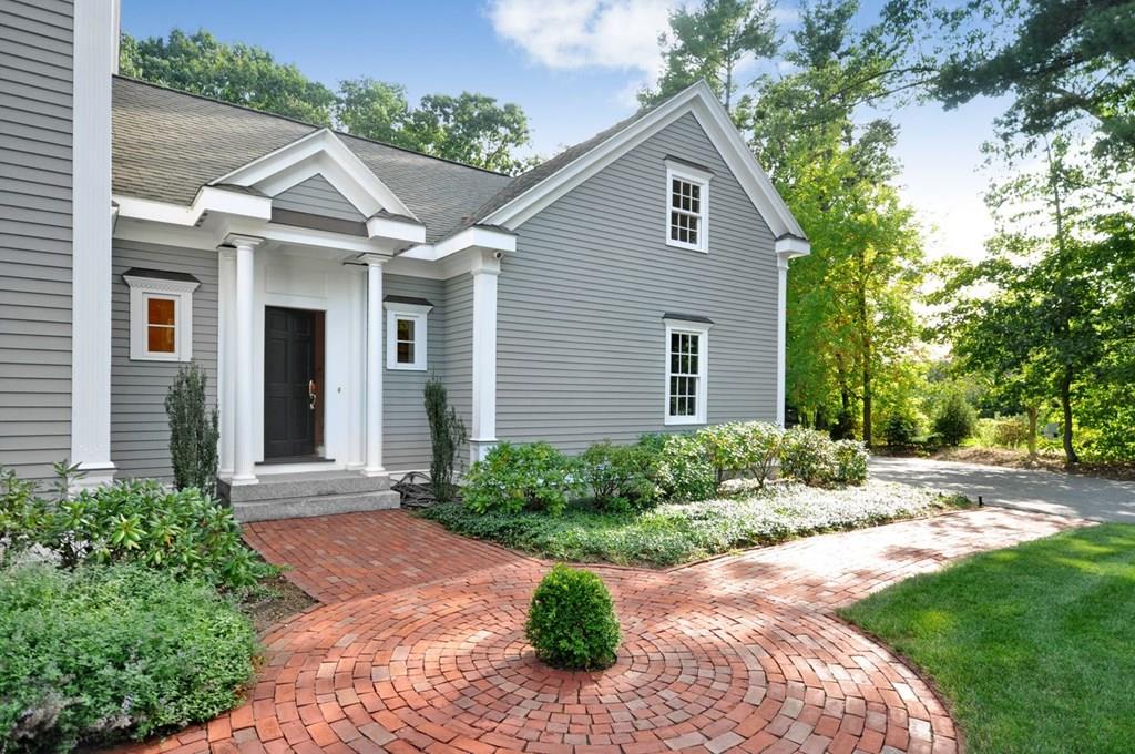 103 Revolutionary Road Concord, MA 01742 - Photo 4 of 39 a front view of a house with garden