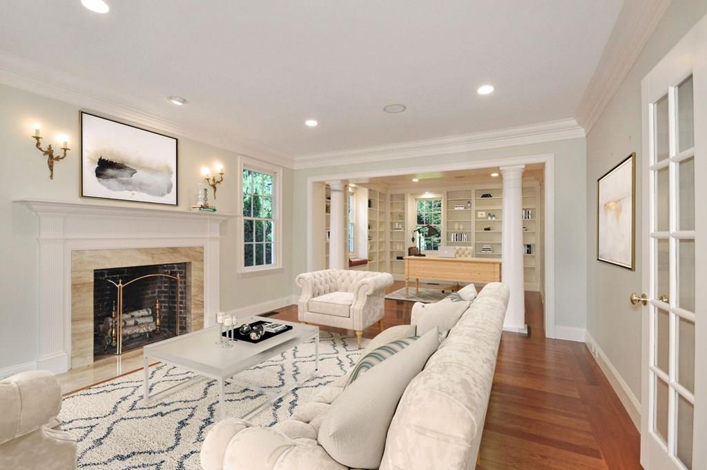 103 Revolutionary Road Concord, MA 01742 - Photo 8 of 39 a living room with furniture and a fireplace