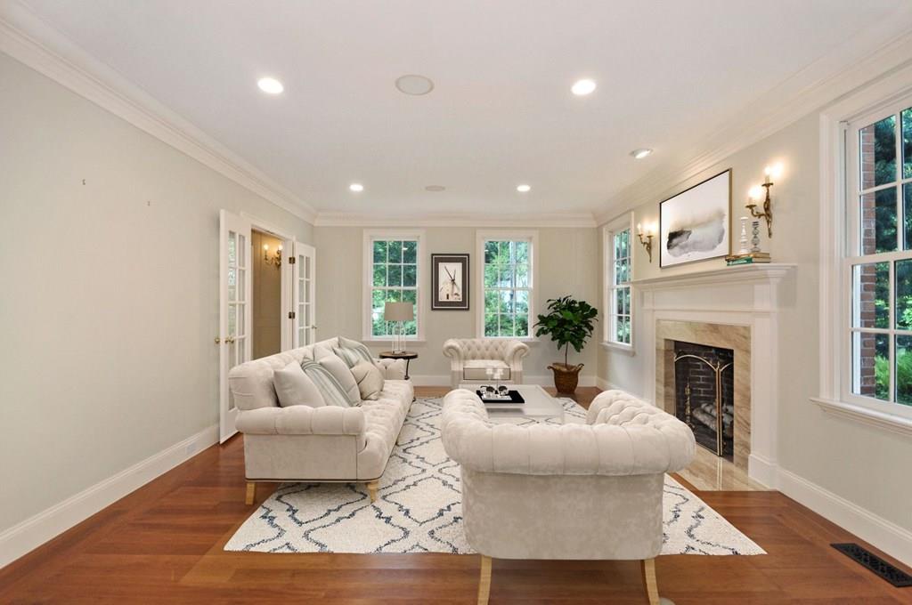 103 Revolutionary Road Concord, MA 01742 - Photo 9 of 39 a living room with furniture and a fireplace