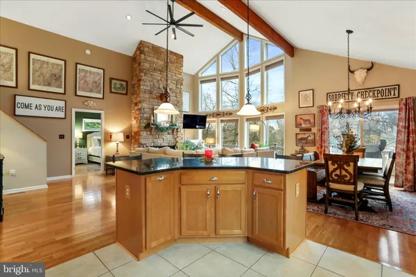 a kitchen with stainless steel appliances a stove and cabinets