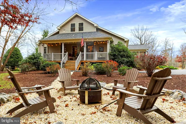 a view of a balcony with chair and wooden floor