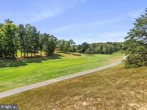 a view of a golf course with a lake