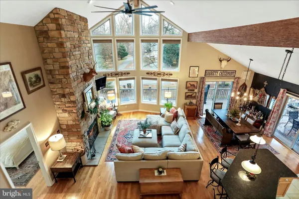 a living room with furniture and a floor to ceiling window
