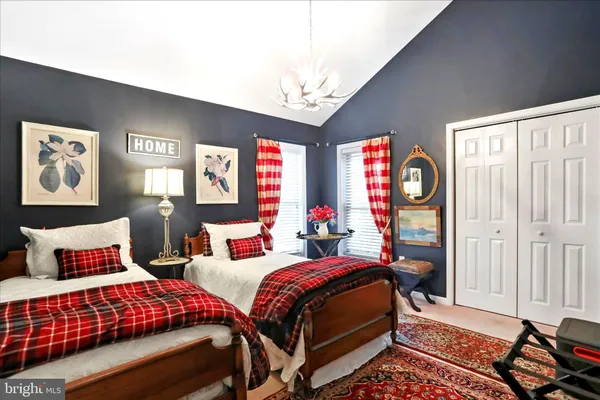 a bedroom with bed and window