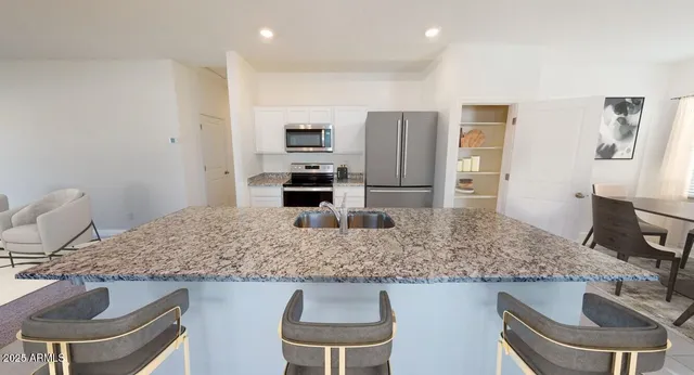 a bathroom with a sink mirror toilet and shower