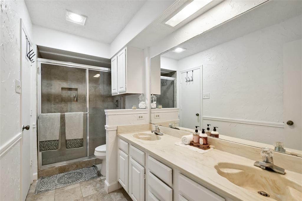 3129 Regency Carrollton, TX 75007 - Photo 21 of 29 a bathroom with a sink toilet and shower