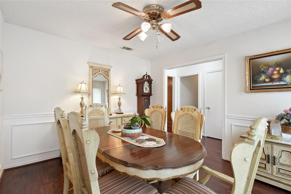 3129 Regency Carrollton, TX 75007 - Photo 5 of 29 a view of a dining room with furniture and wooden floor