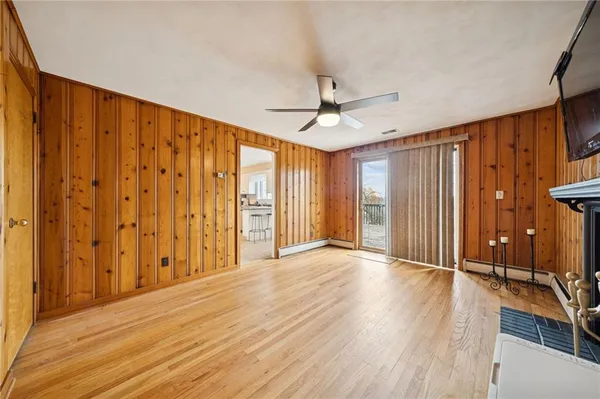 a view of a livingroom with wooden floor