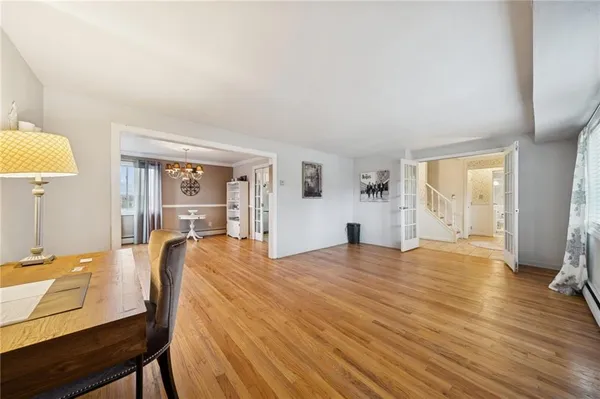 a view of a livingroom with furniture and a wooden floor