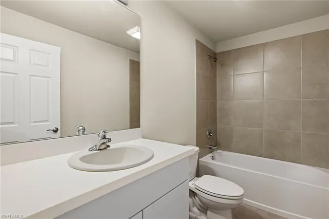 a bathroom with a sink toilet and a bathtub