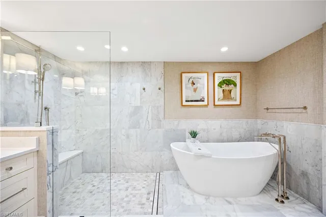 a bathroom with a bathtub and shower