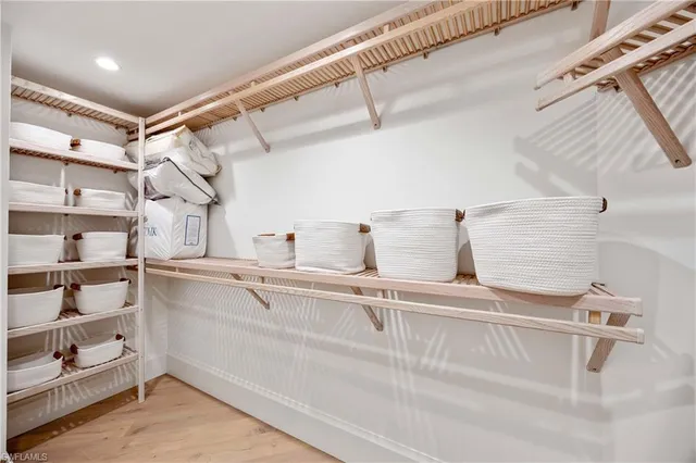 a kitchen with cabinets and window