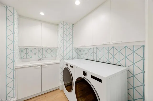 a utility room with dryer and washer