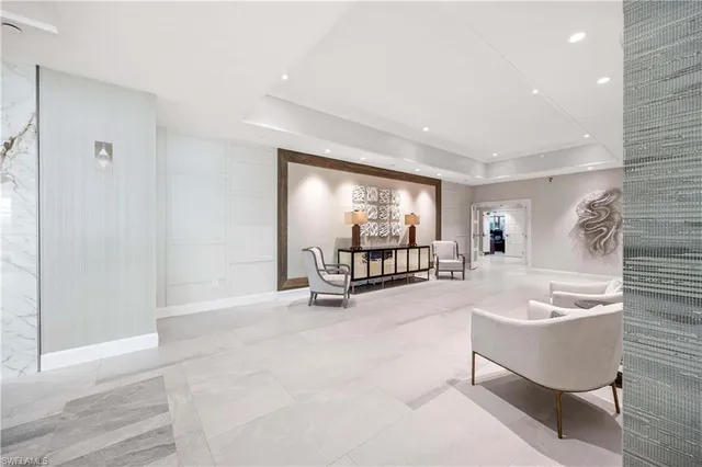 a spacious bathroom with a tub sink and mirror