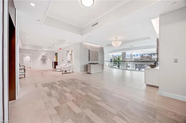 a view of a living room and kitchen with furniture