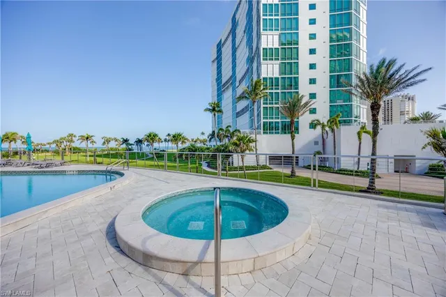 a view of a swimming pool and a yard
