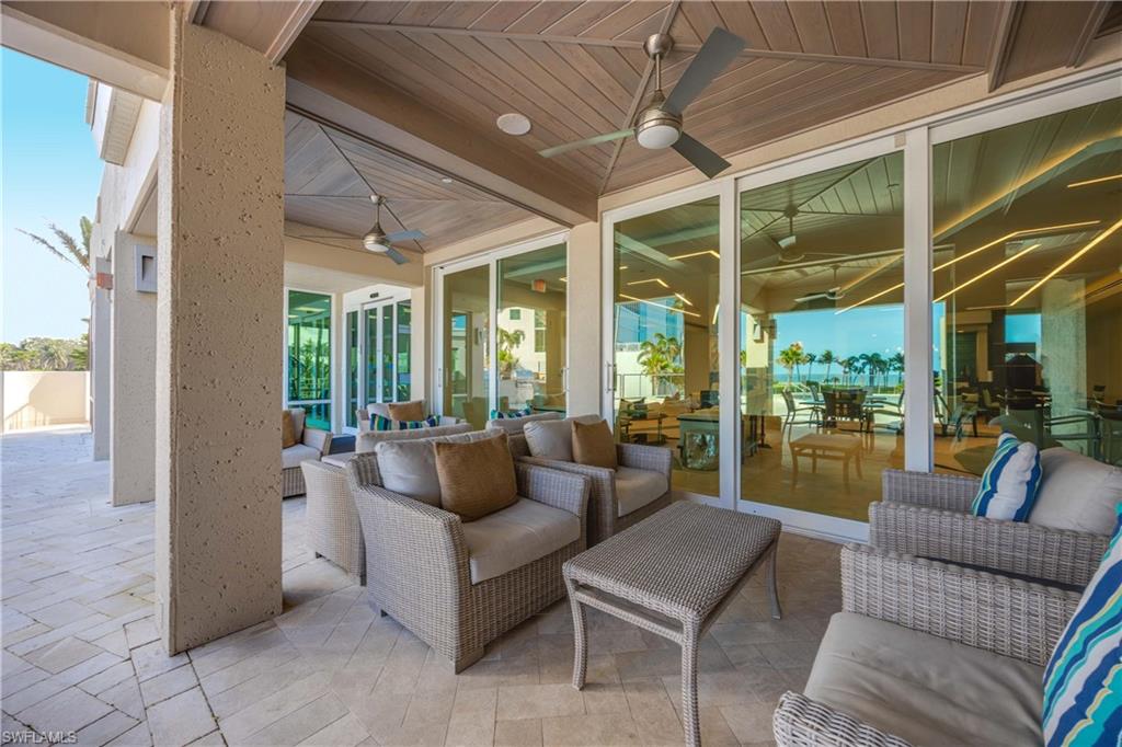 3971 Gulf Shore Boulevard North, Unit 401 Naples, FL 34103 - Photo 46 of 50 a living room with furniture and a large window