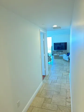 a kitchen with a table chairs stove and cabinets