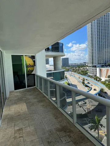 a view of swimming pool from a balcony