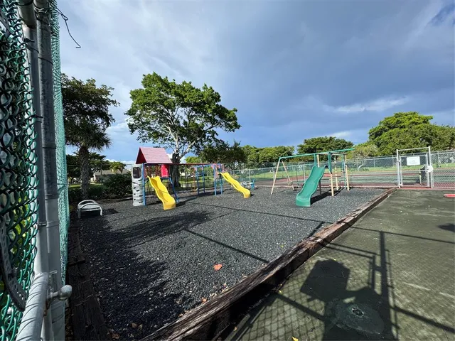 a view of a park with sitting area