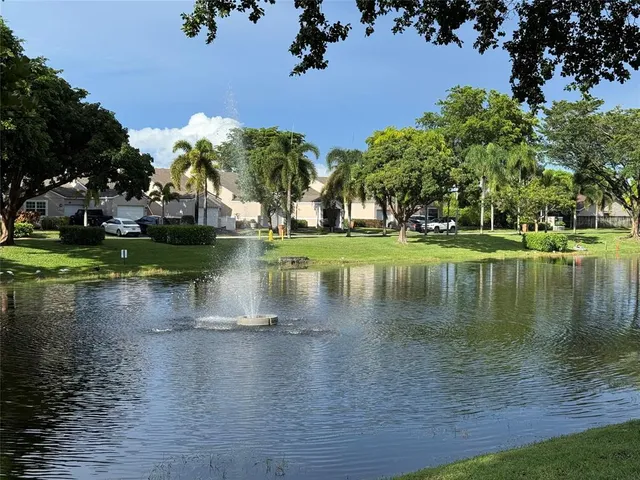 a view of a lake with a building in the background