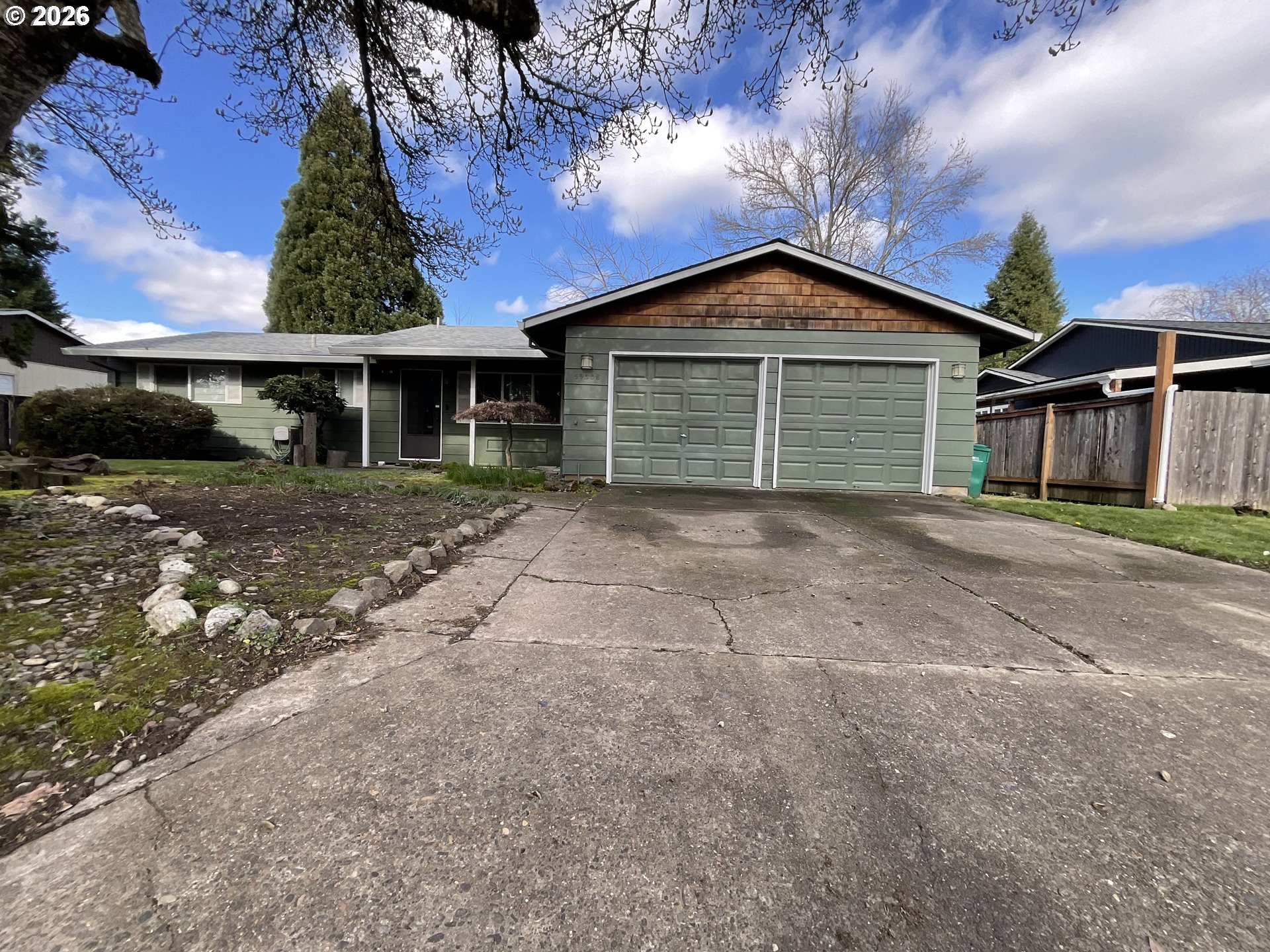 19305 Southwest York Street Beaverton, OR 97003 - Photo 1 of 34 a front view of house with yard and trees