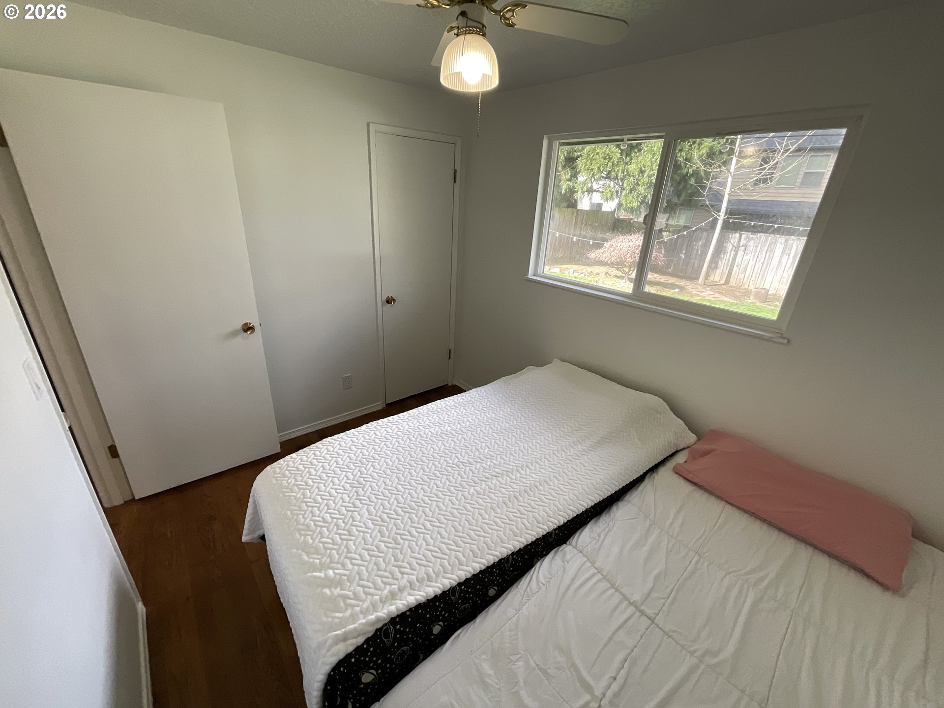 19305 Southwest York Street Beaverton, OR 97003 - Photo 21 of 34 a bedroom with a bed and a window