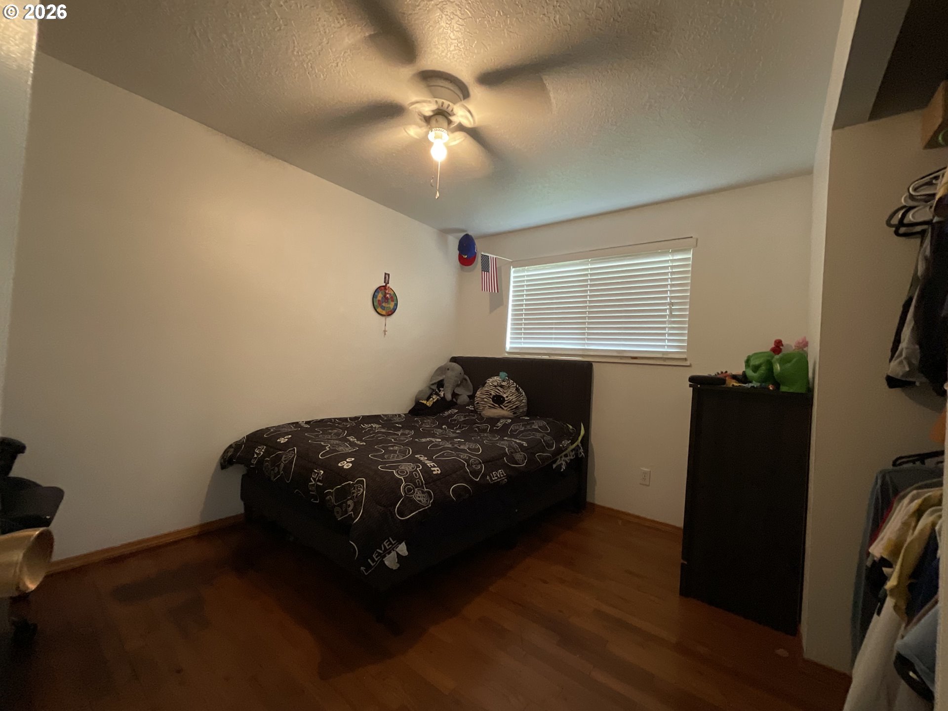 19305 Southwest York Street Beaverton, OR 97003 - Photo 22 of 34 a bed sitting in a bedroom next to a window