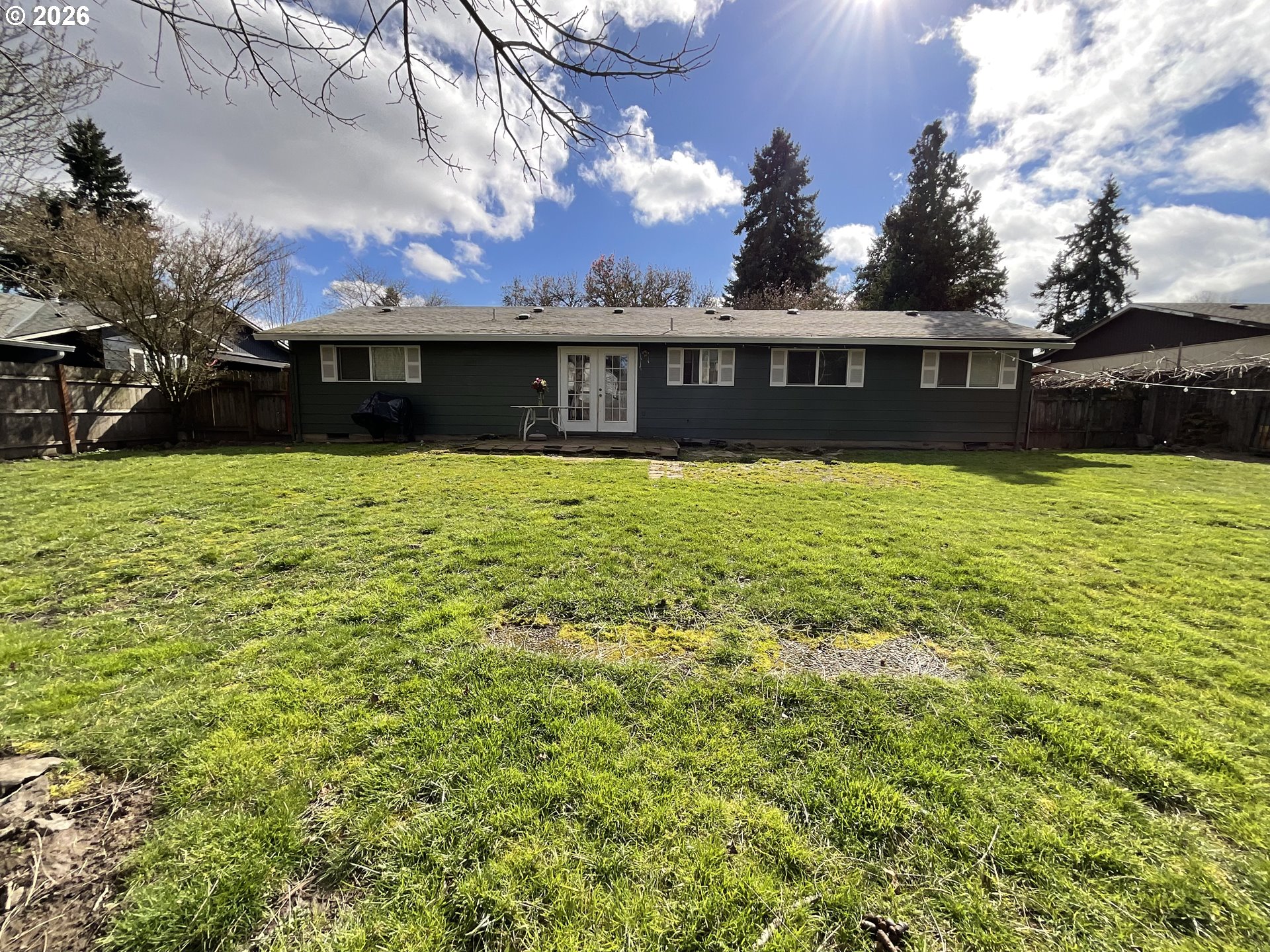 19305 Southwest York Street Beaverton, OR 97003 - Photo 29 of 34 a front view of a house with a yard