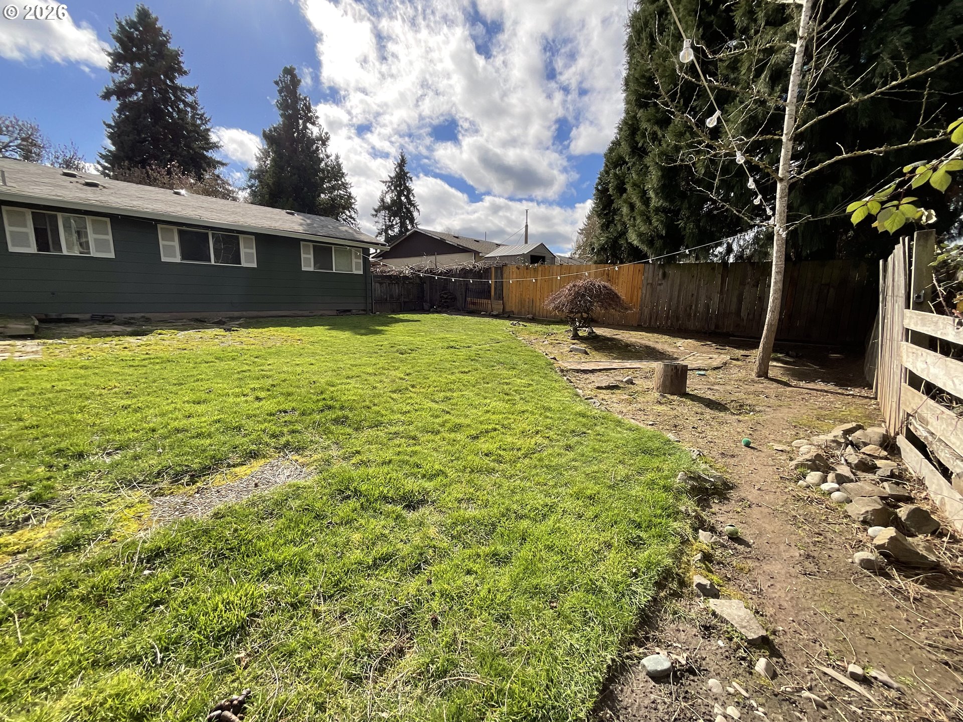 19305 Southwest York Street Beaverton, OR 97003 - Photo 30 of 34 a view of a house with a backyard