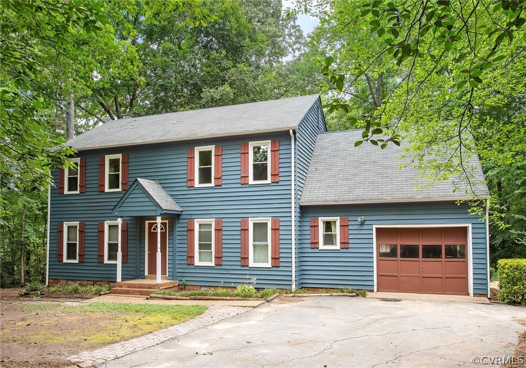 13910 Barnes Spring Road Midlothian, VA 23112 - Photo 2 of 30 a front view of a house with a garden