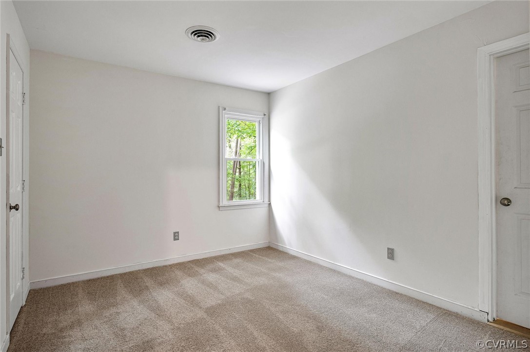 13910 Barnes Spring Road Midlothian, VA 23112 - Photo 23 of 30 a view of an empty room with a window