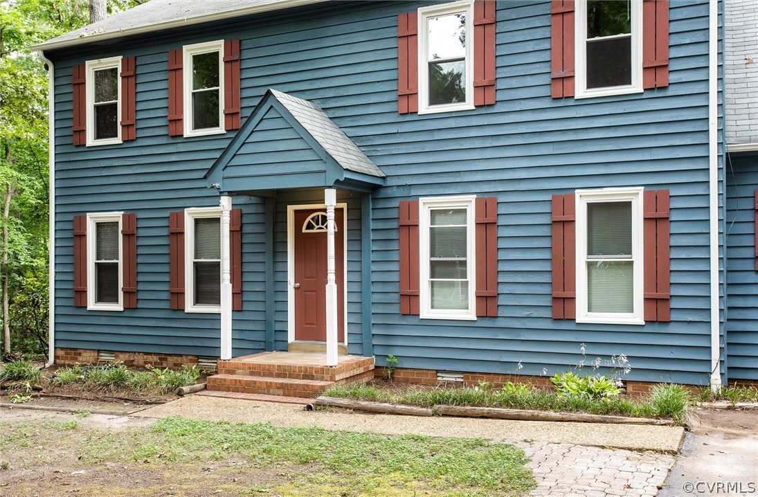 13910 Barnes Spring Road Midlothian, VA 23112 - Photo 3 of 30 a view of a house with small yard plants and wooden fence