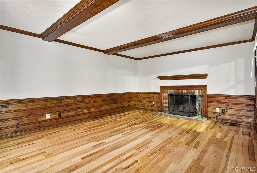 13910 Barnes Spring Road Midlothian, VA 23112 - Photo 8 of 30 a view of empty room with wooden floor and fireplace