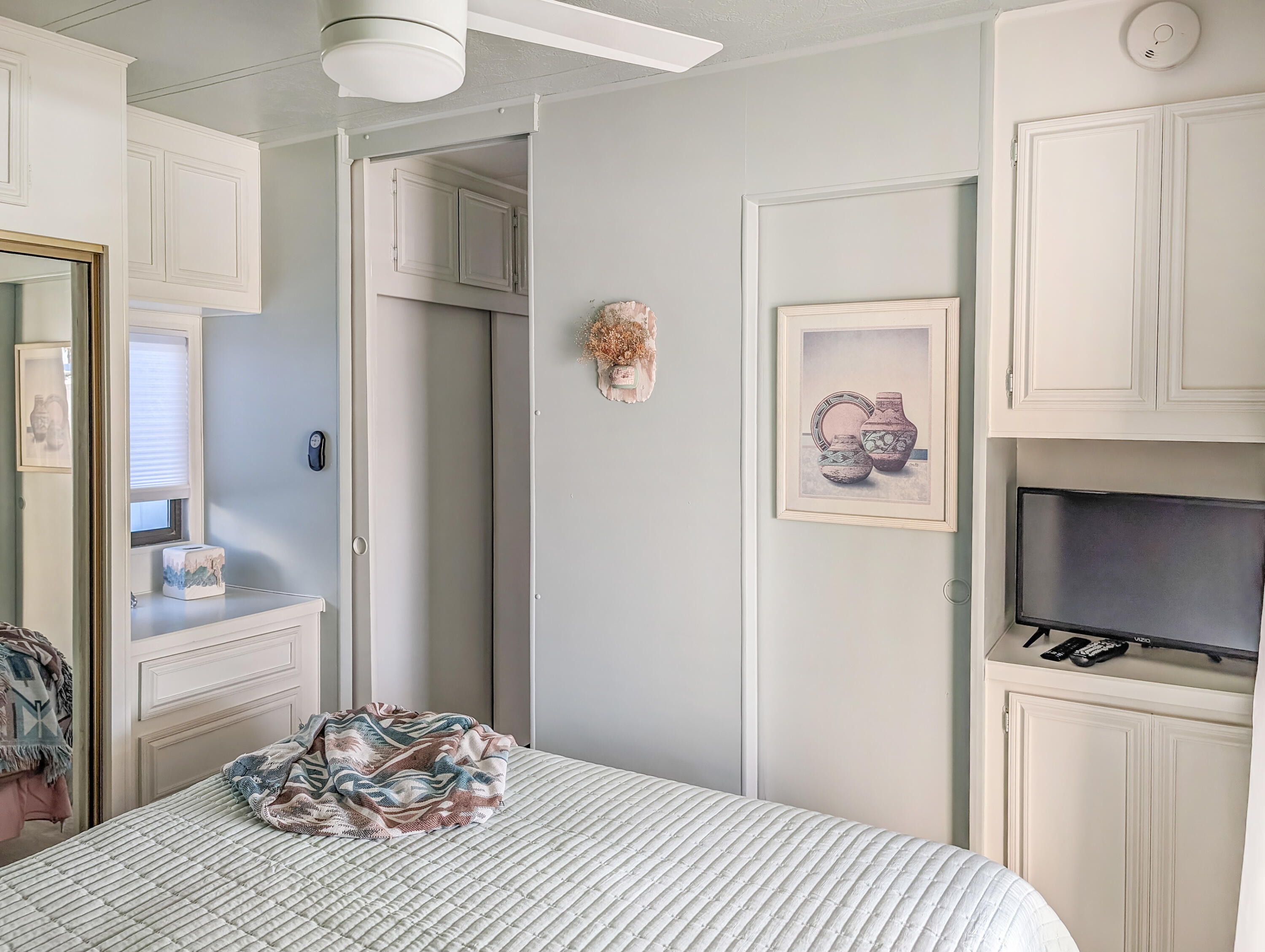 70200 Dillon Road, Unit 111 Desert Hot Springs, CA 92241 - Photo 12 of 25 a bedroom with a bed and a window