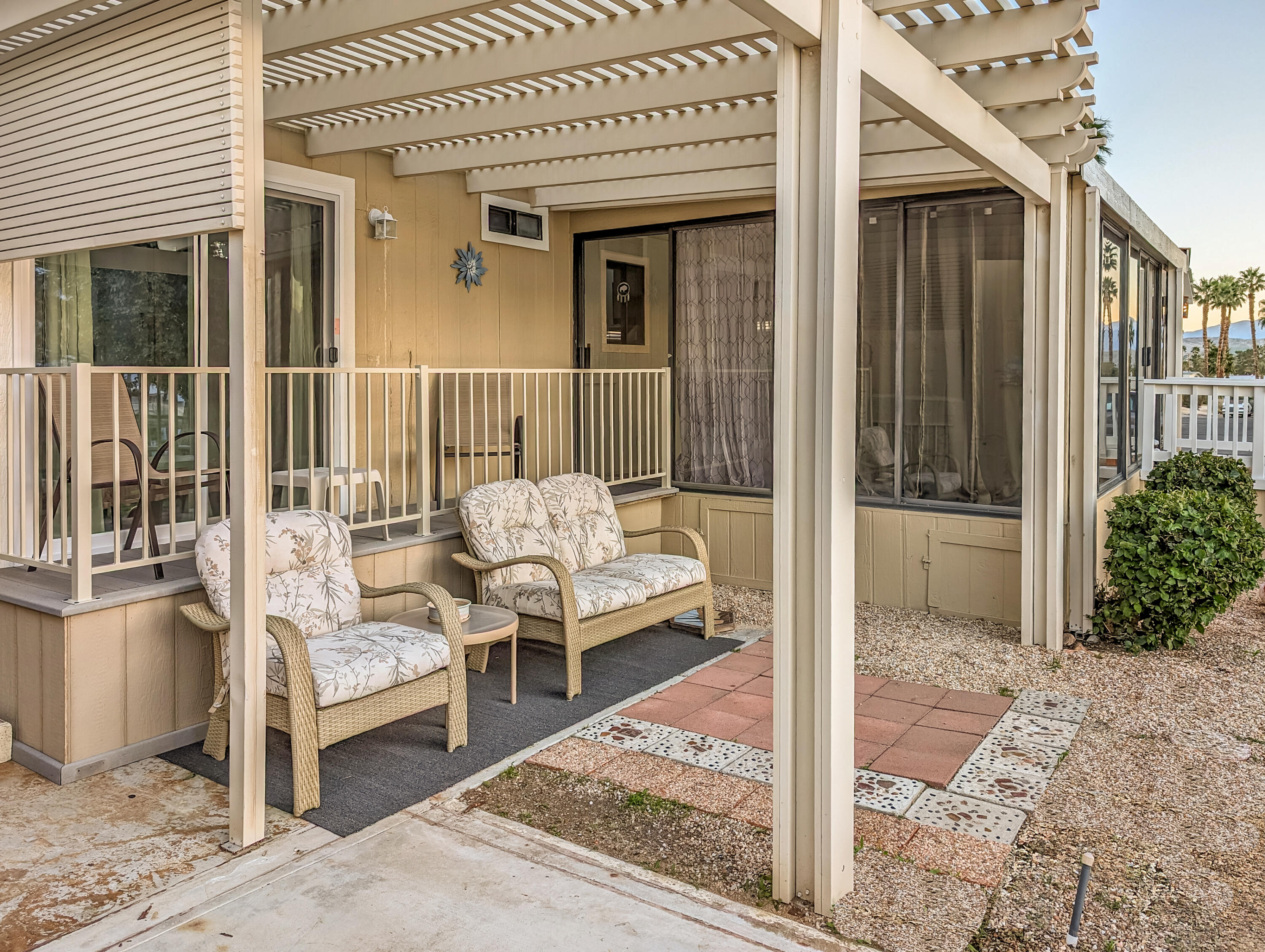 70200 Dillon Road, Unit 111 Desert Hot Springs, CA 92241 - Photo 16 of 25 a balcony with table and chairs