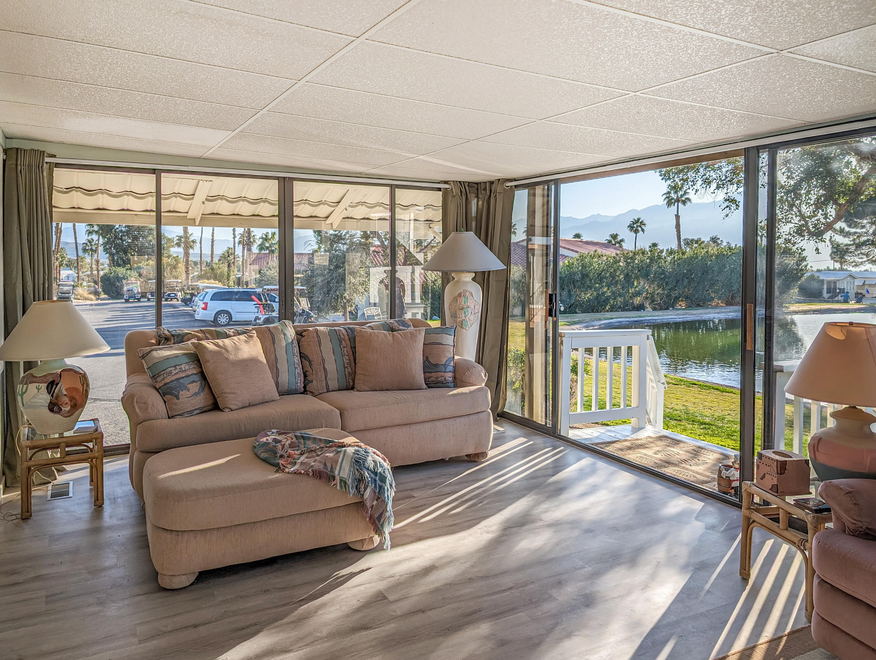 70200 Dillon Road, Unit 111 Desert Hot Springs, CA 92241 - Photo 3 of 25 a living room with furniture and a large window